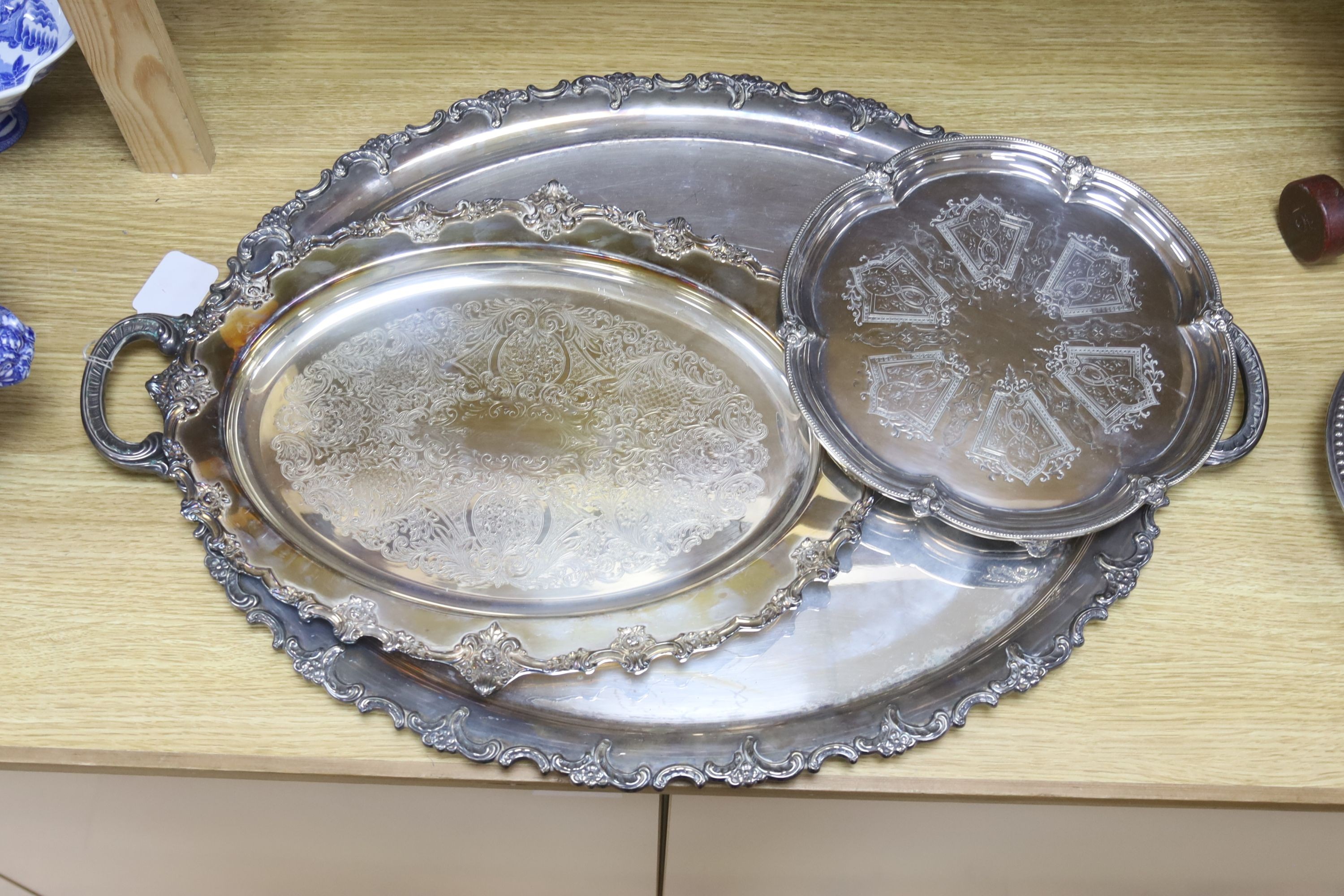 A plated two-handled large oval tray, another oval tray, an entrée dish and cover and a salver (4)